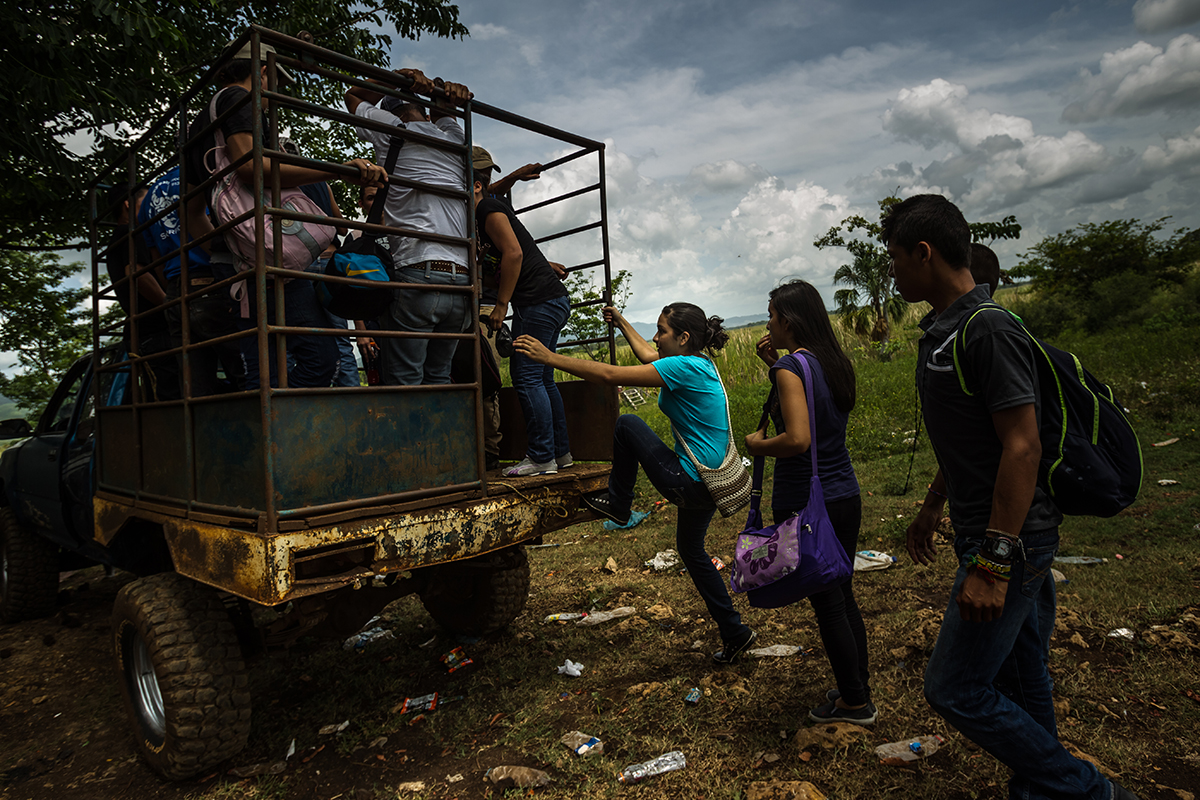 Two sisters and a friend from Honduras, ages 13, 14, and 16, arrive at a cattle ranch along the border between Guatemala and Mexico in July 2014, with their coyote, who is smuggling them to the United States to be reunited with their parents in Texas and California. The sisters have not seen their parents for six years, and their friend has not seen her parents for 12 years. While reunification with family members is a factor for many youth risking the dangerous journey to the United States, domestic violence, sexual violence, and other forms of gender-based violence – in addition to impunity for these crimes – are influencing the decision to flee. Photo by Meridith Kohut.