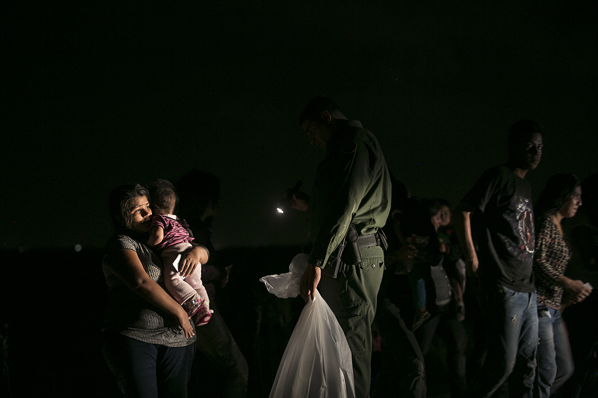 Women and children from Central America are apprehended just after crossing the Rio Grande into Texas, in June 2014. In July 2014, Mexico’s National Migration Institute began to intensify interdiction efforts in southern Mexico by carrying out more mobile highway checkpoints and raids. Human rights advocates have documented the use of brutal tactics by Mexican authorities in enforcement operations, including pushing individuals off moving trains. Photo by Kirsten Luce.